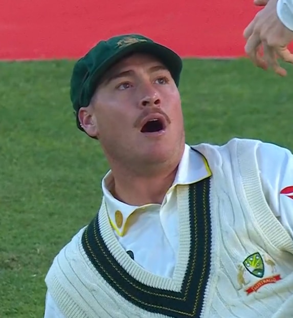 A cricket player looks shocked
