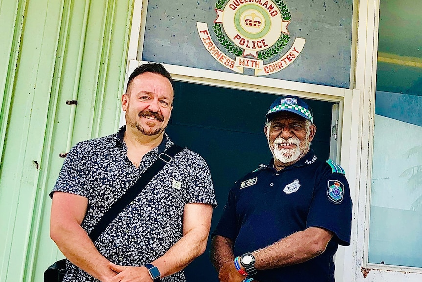 Professor John Scott stands next to police liaison officer Ned Mosby.