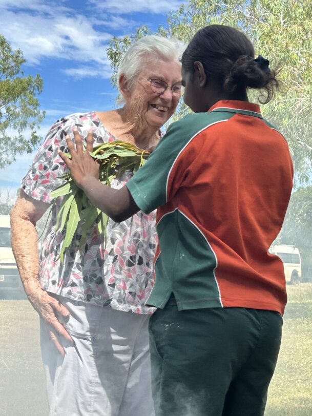 A young Aboriginal woman and an elderly woman at a traditional ceremony