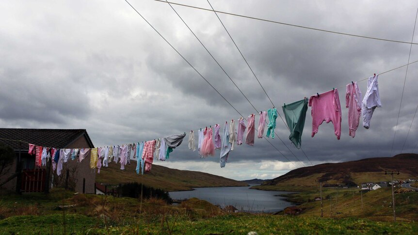 Laundry hangs on a clothes line on the mainland of the Shetland Islands
