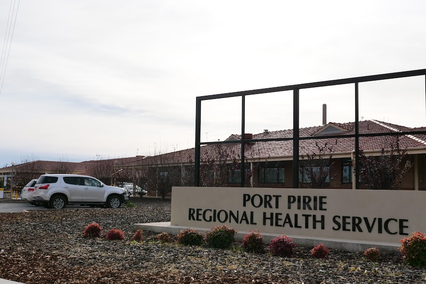 A large sign reading Port Pirie Regional Health Service outside a collection of buildings.