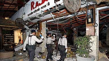 Indonesian security personnel at a devastated restaurant in Kuta [File photo].