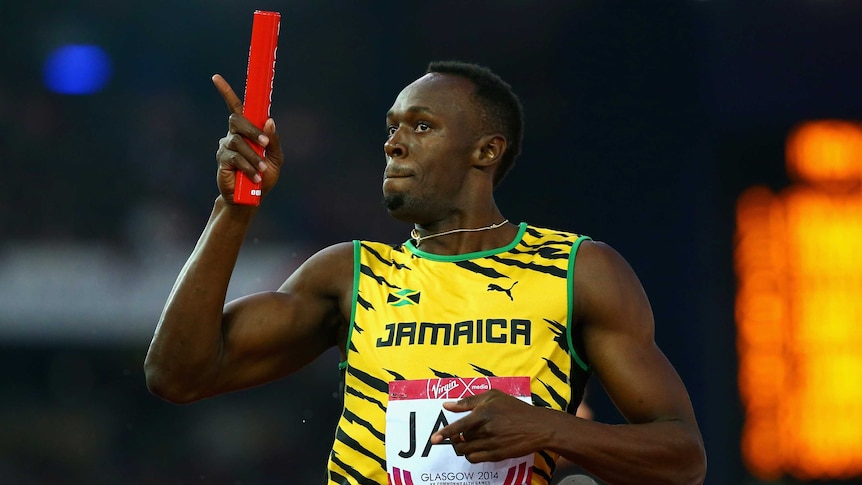 Usain Bolt crosses the line in the relay