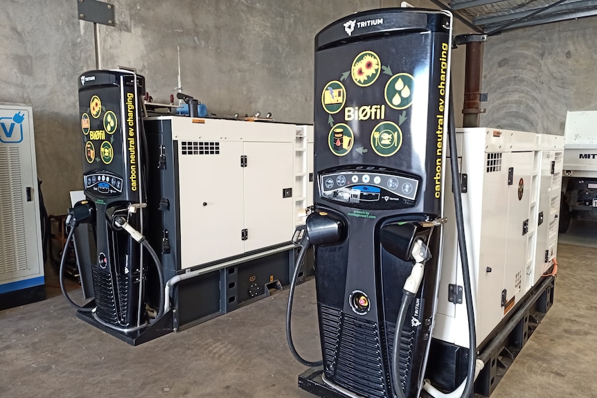 Two large metal boxes with power cords and sockets