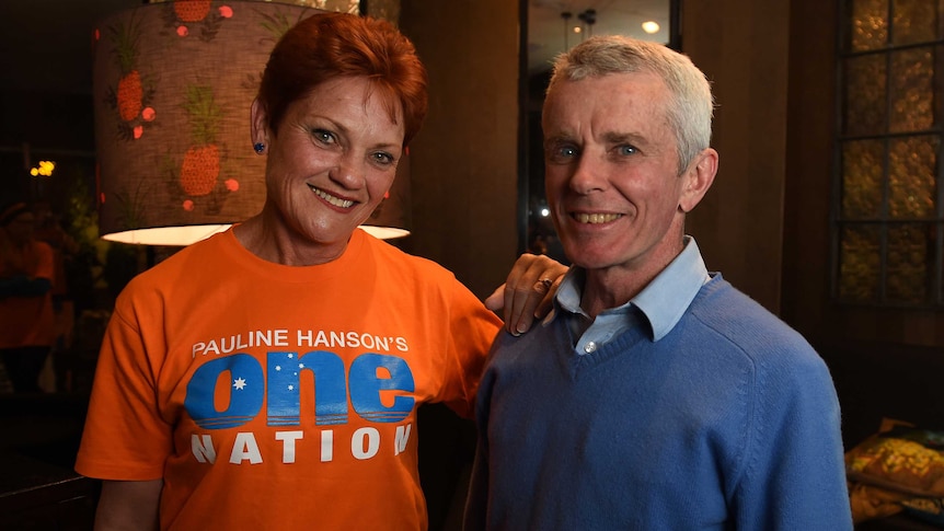 One Nation's Pauline Hanson poses for a photo with Malcolm Roberts, number two on her senate ticket.