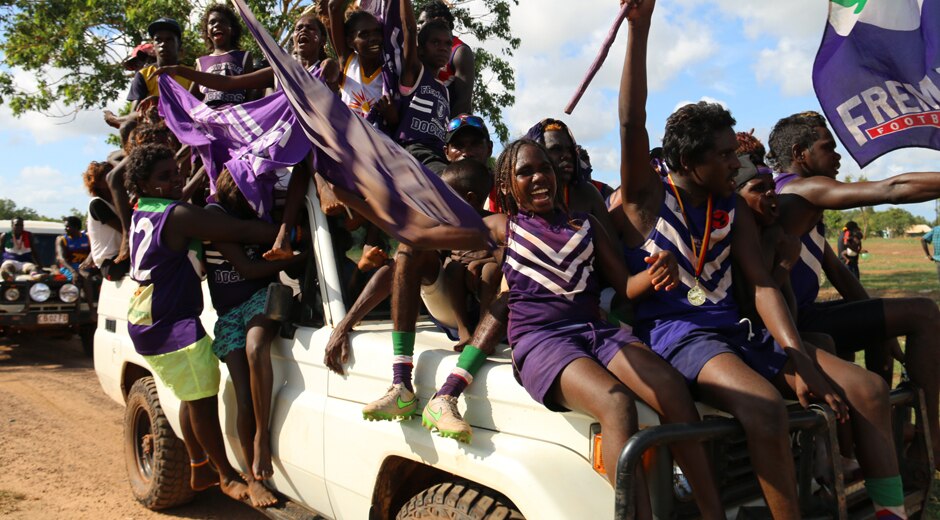 Ecstatic Wudupulli Nama Dockers fans celebrate their win after the 2015 Wadeye football Grand Final.