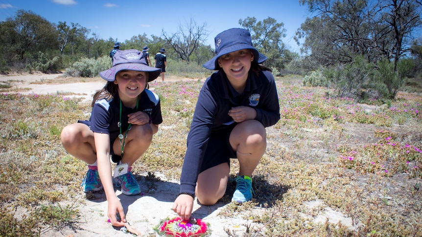 Arranging native flowers are Barmera Primary School student Tahlia and Our Lady of the River student Charlie.