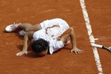 French kiss: Italy's Francesca Schiavone shares a moment with the Paris clay after beating Sam Stosur.