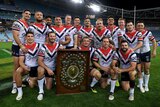 Roosters players pose with the JJ Giltinan Shield.