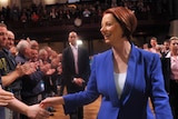 Warm welcome ... Julia Gillard shakes hands with delegates on her arrival at the conference.