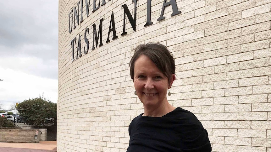 Professor Jane Pirkis stands outside the University of Tasmania.