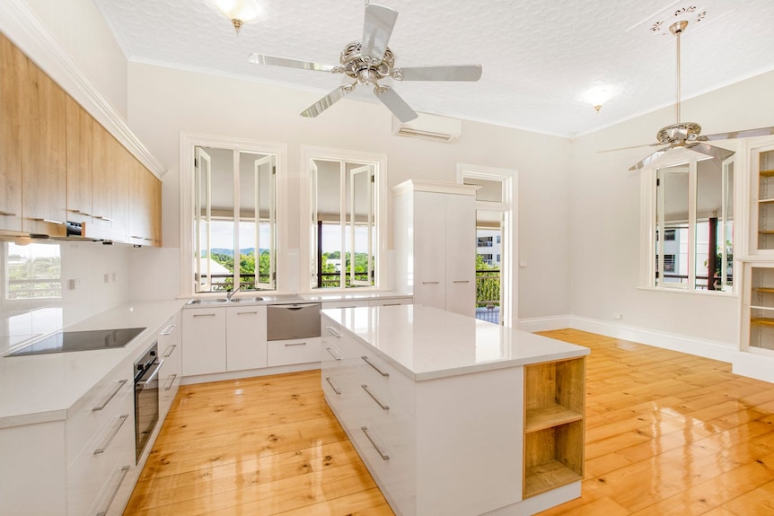 The interior of a Queenslander with a renovated kitchen. 