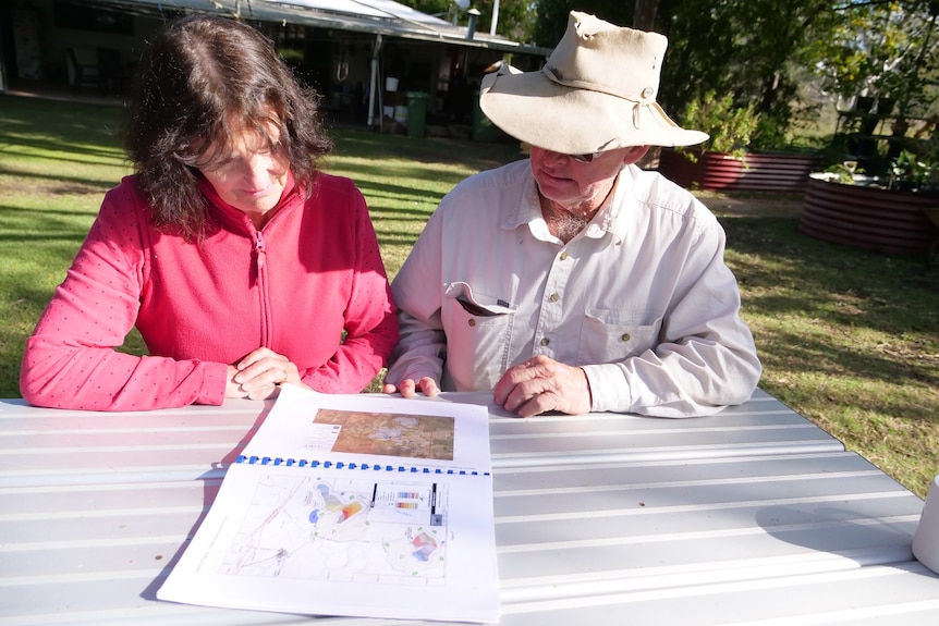 Allan and Jane Vaughn look at a map on their table