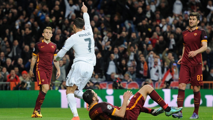 Real Madrid's Cristiano Ronaldo celebrates the opening goal in Champions League tie against Roma.