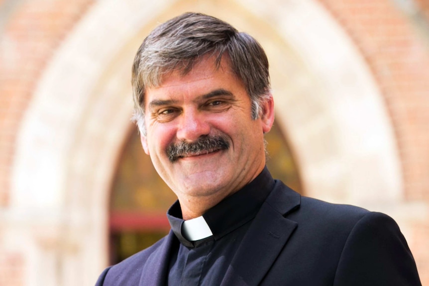 A head shot of a smiling Reverend Richard Pengelley.