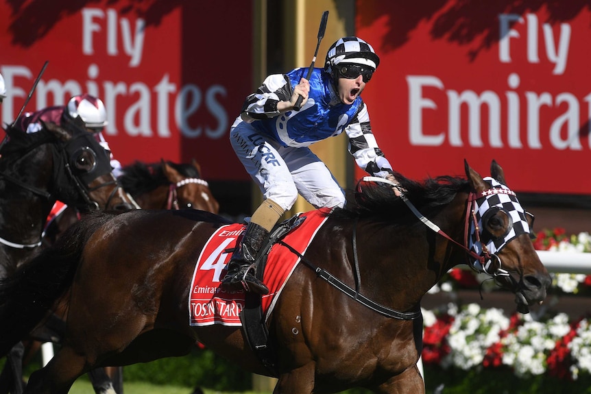 Damian Lane rejoices after riding Tosen Stardom to victory in the Stakes.