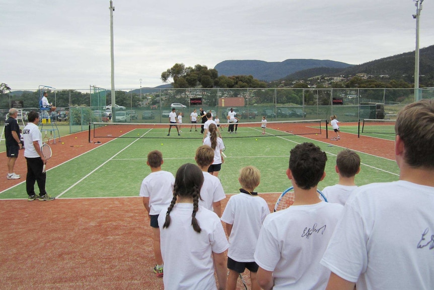 Children taking part in the tennis coaching clinic in Hobart.