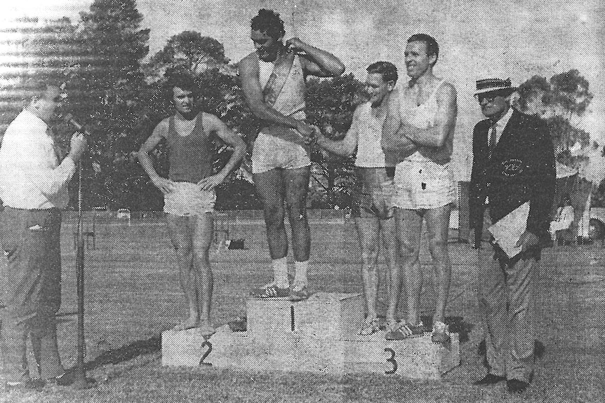 Derek Peardon accepting his sash for winning the 1969 Leongatha gift