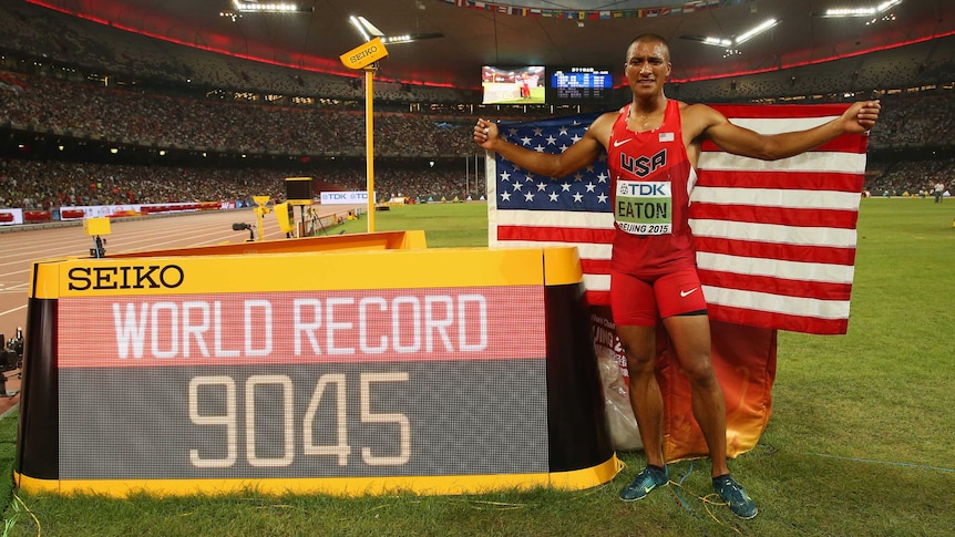 American Ashton Eaton poses after setting a new decathlon world record in Beijing.