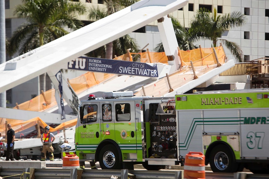 Emergency personnel respond to a collapsed pedestrian bridge at Florida International University.