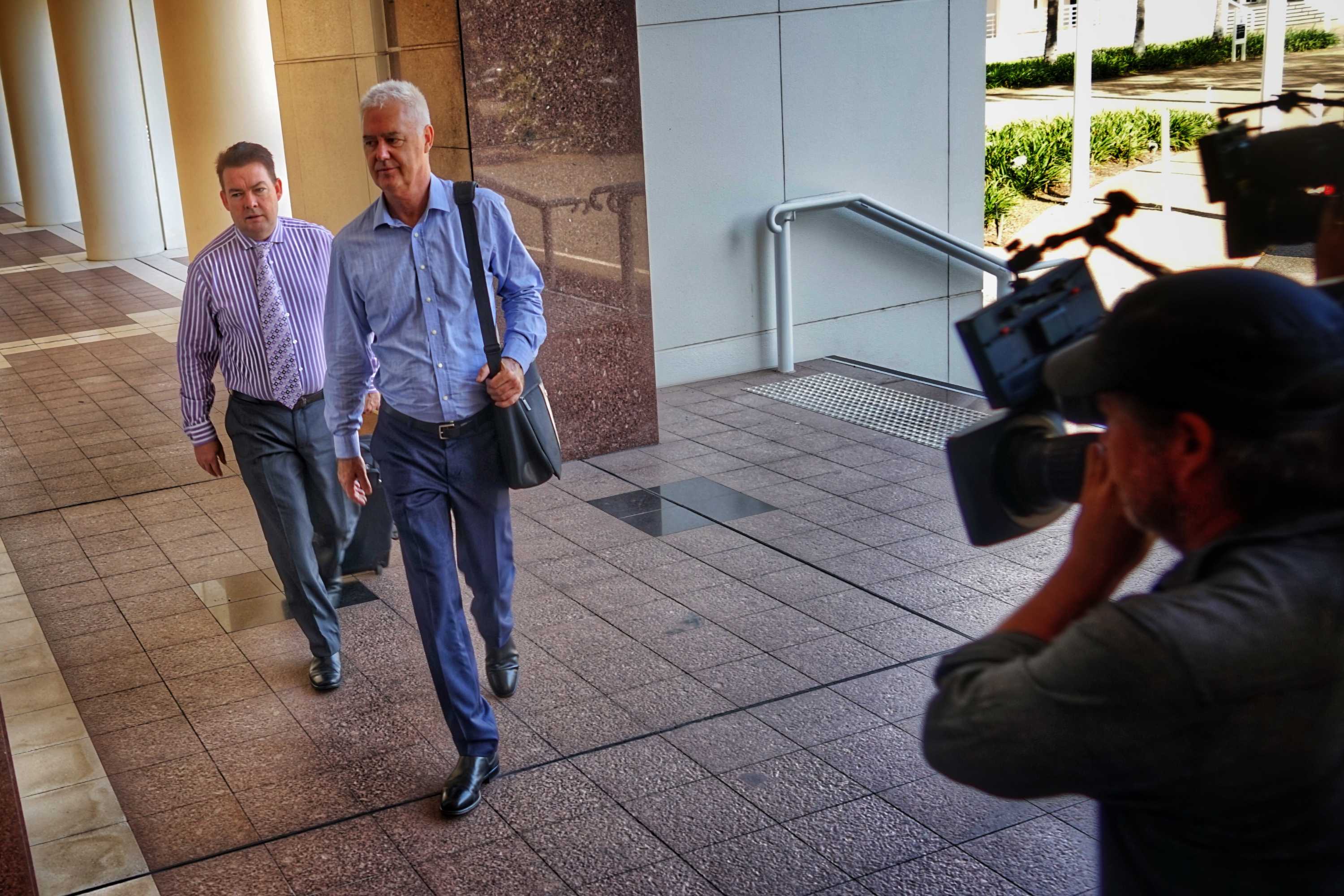 John McRoberts and his lawyer enter the NT Supreme Court.