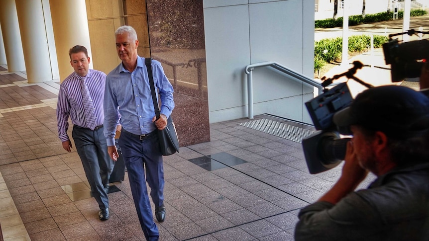 John McRoberts and his lawyer enter the NT Supreme Court.
