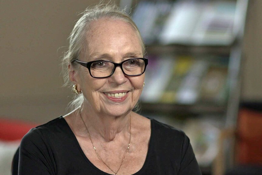 Robin Dougherty wears glasses and a black top
