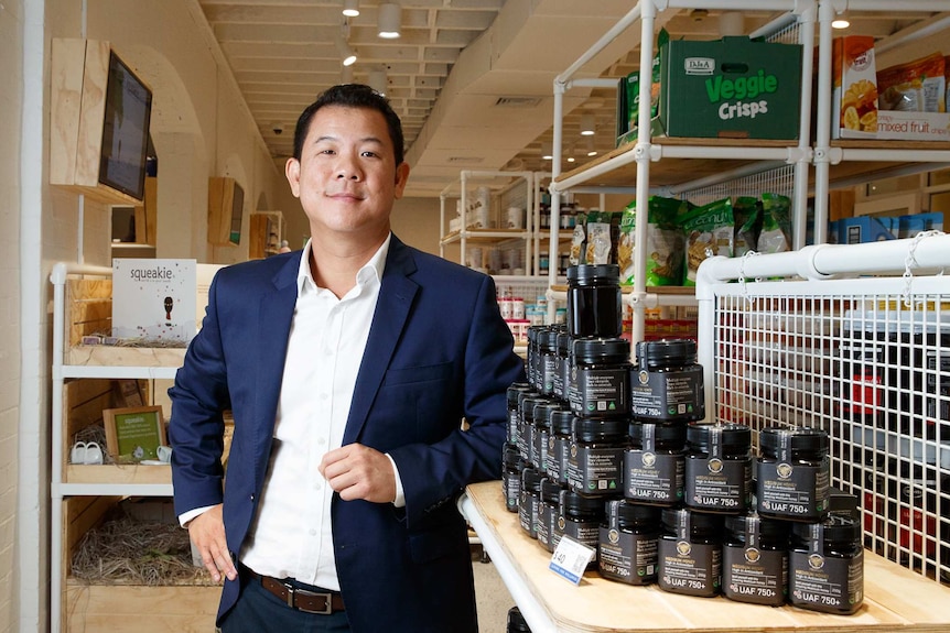 AuMake chairman Keong Chan stands in a retail store.