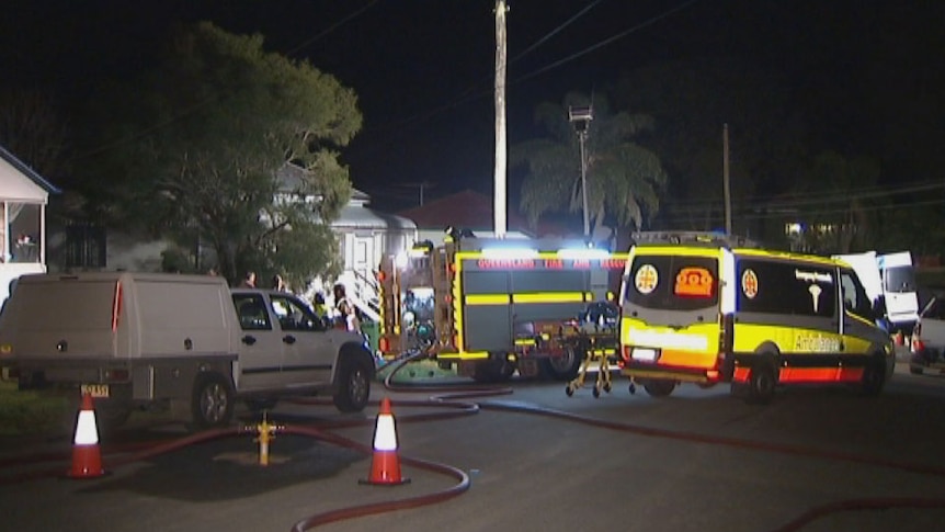 Authorities outside house where a man was seriously injured in an explosion at West Ipswich