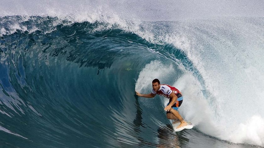 Joel Parkinson rides a wave at the Pipeline Masters