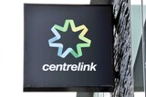A Centrelink office sign on a building.