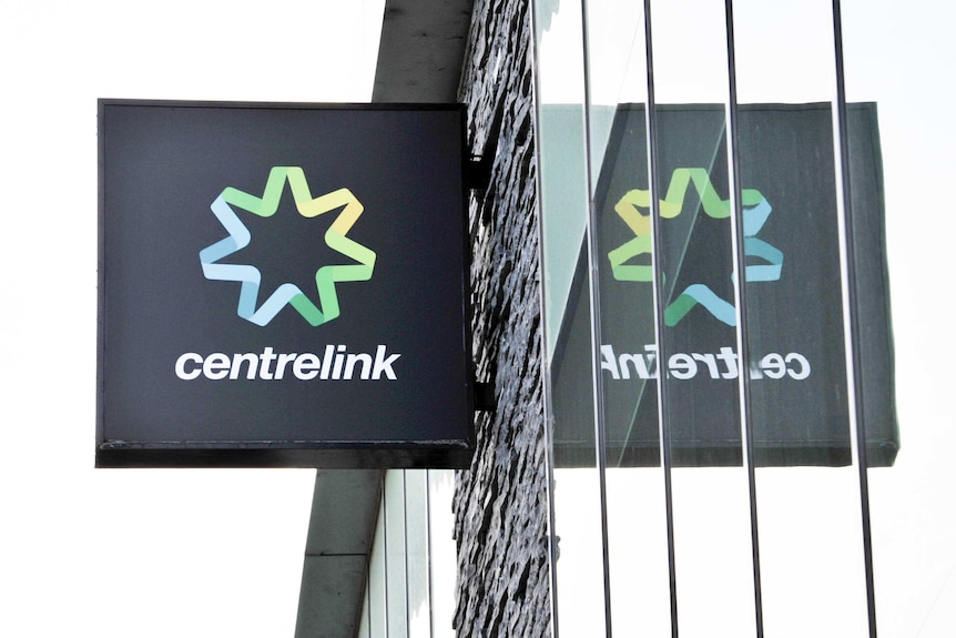 A Centrelink sign outside of a suburban branch