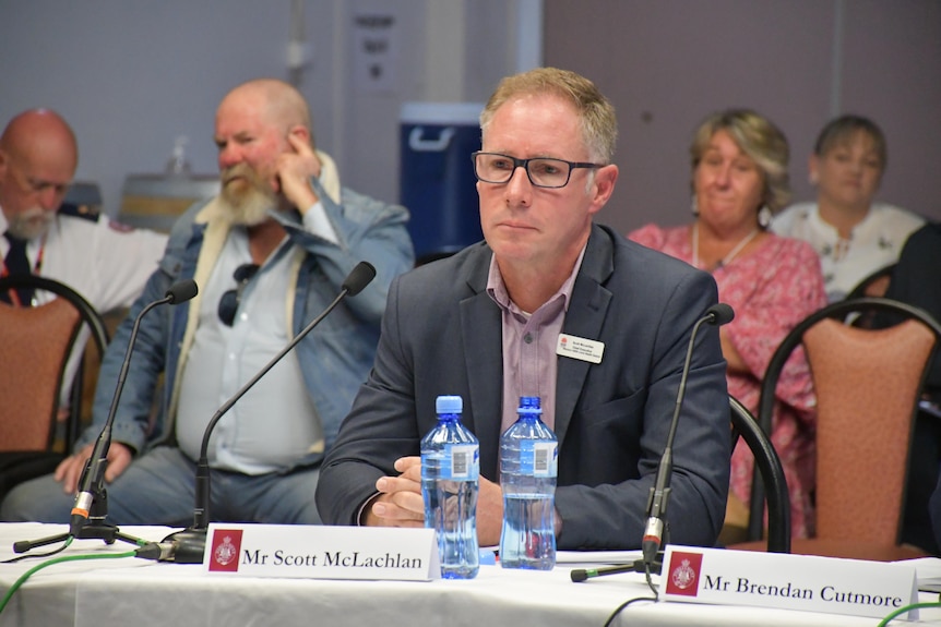 A man sitting at in inquiry.