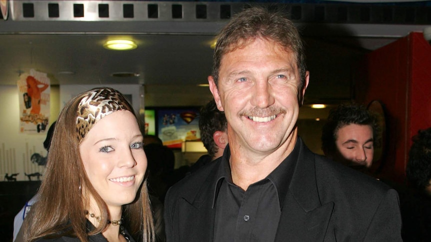 Brett Kenny poses with a woman at a cinema.