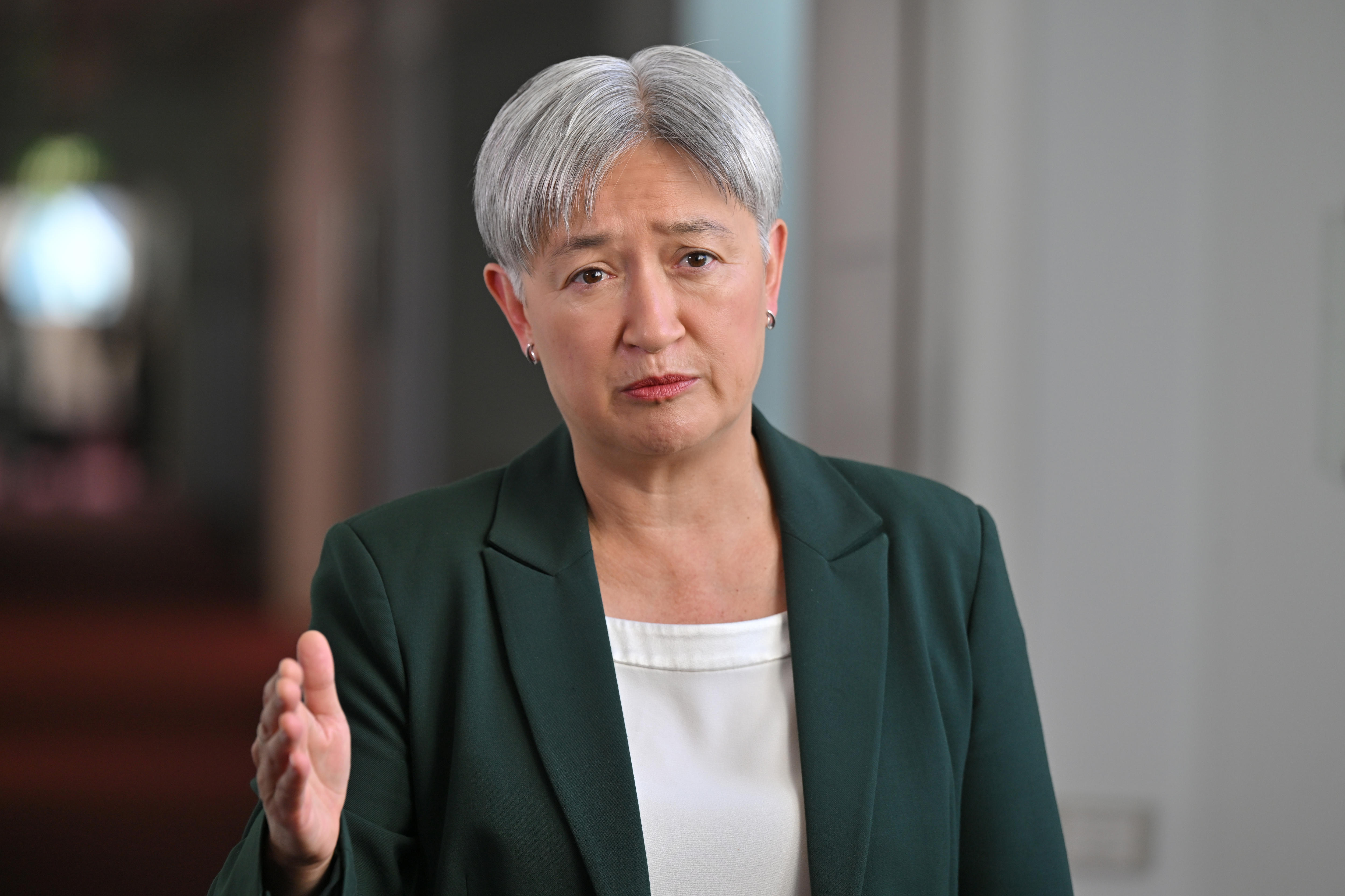 Live: Non-essential Australian officials directed to leave UAE, Israel