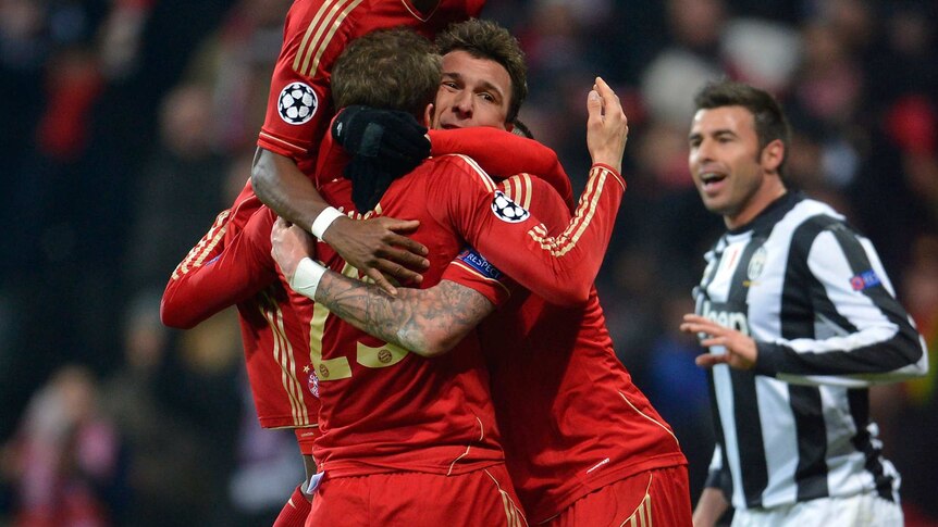 Clincher ... Thomas Muller celebrates with team-mates after scoring Bayern's second goal.