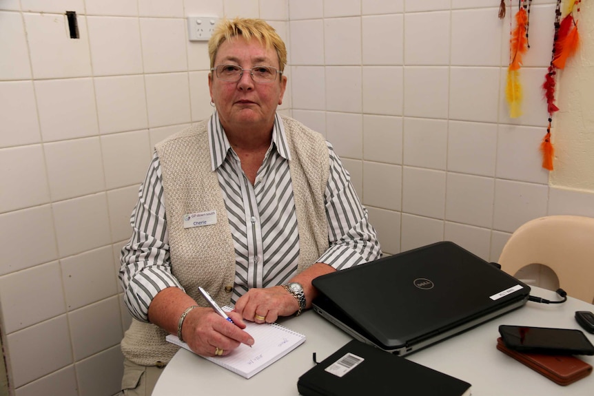 Woman sitting at computer desk