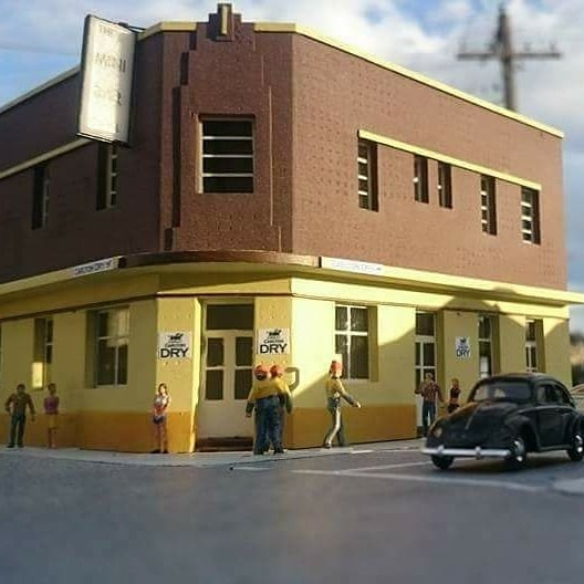 A model of an Art Deco pub on a street corner.