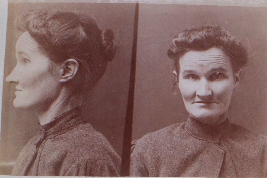 A faded sepia prison photo depicting a middle-aged woman.