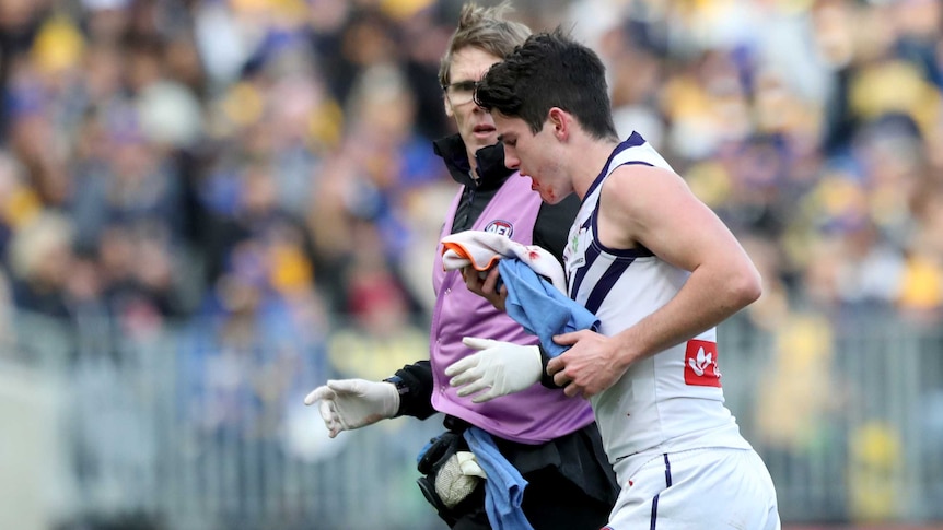 Andrew Brayshaw of Fremantle comes off injured against West Coast