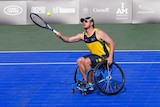 James in a wheelchair hitting a ball with a tennis racquet