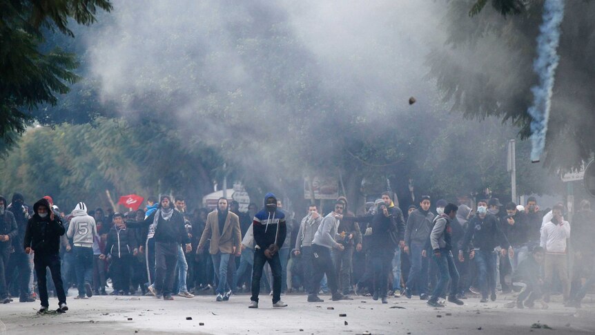 Tunisian protesters clash with riot police