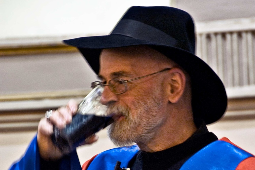 Terry Pratchett drinking Guinness