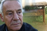A close up shot of an old man with watery eyes standing in a park, next to an old photo of an African national park sign.