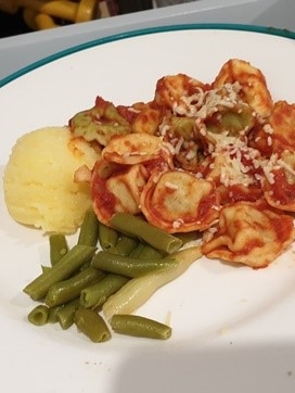 Pasta, beans and mashed potato on a plate.