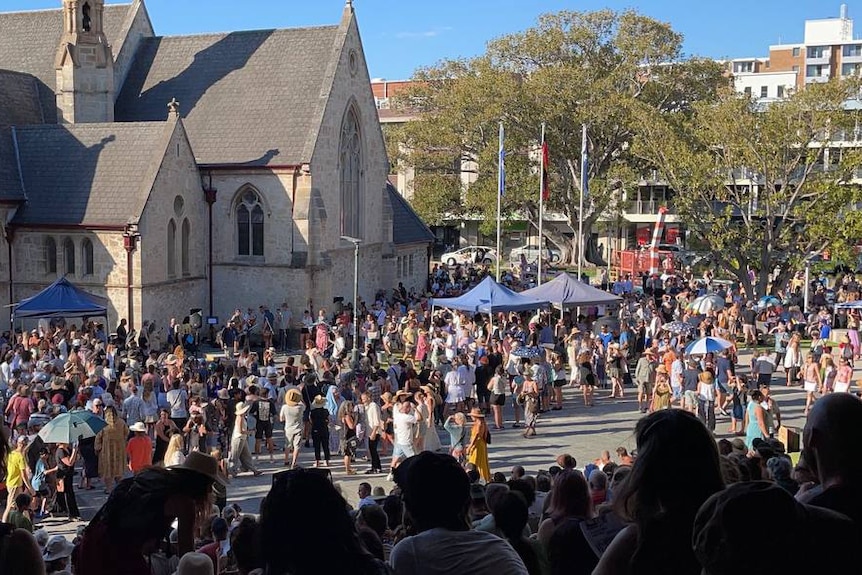 Crowds gather outside a church