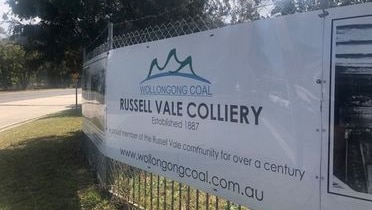 A sign on a fence showing Russell Vale colliery