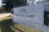 A sign on a fence showing Russell Vale colliery