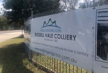 A sign on a fence