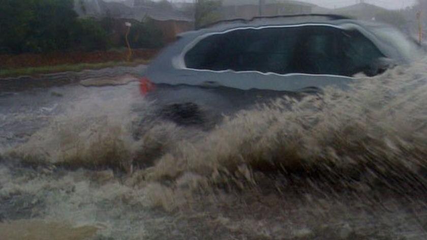 Perth's roads have been inundated during a sudden storm.